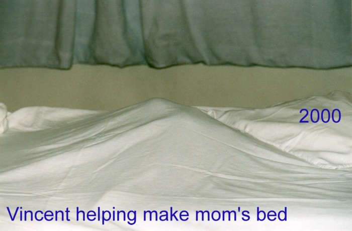 Vincent_2000_helping_make_moms_bed